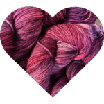 a heart shaped image filled with tich puum and berry purple yarn, subtly variegated with depth and warmth.