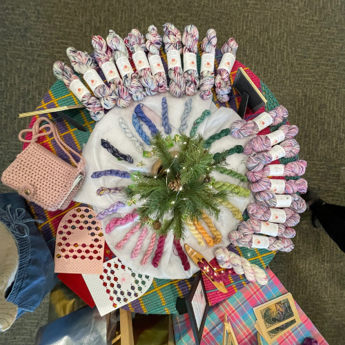 Full Advent collection display featuring The Weaver’s Light yarn skeins and coordinating mini skeins arranged in a circular layout.