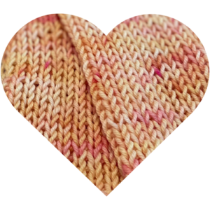 Heart-shaped knit swatch of peach and blush hand-dyed yarn from the Beginning Again colorway